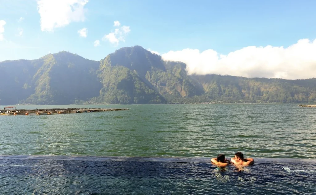 Toya Devasya hot spring pool overlooks Mount Batur.